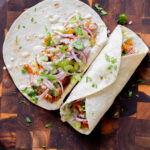 two vegan buffalo cajun wraps, one open and one closed