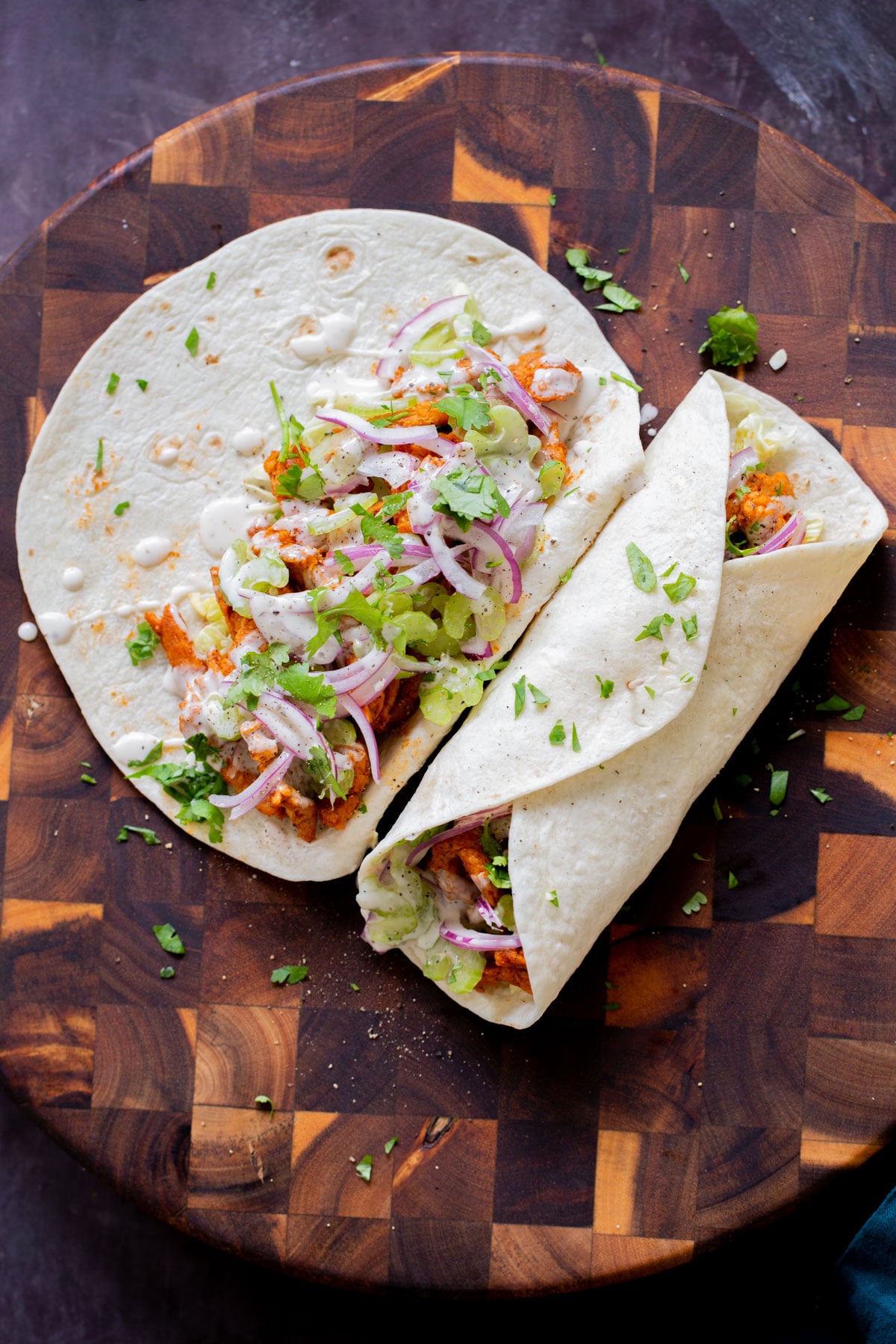 two vegan buffalo cajun wraps, one open and one closed