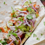 close-up of an open buffalo cajun wrap, so you can see the filling
