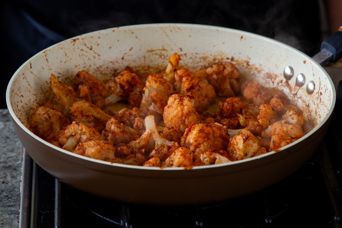 harissa paste and spices toss with the cauliflower, before cooking