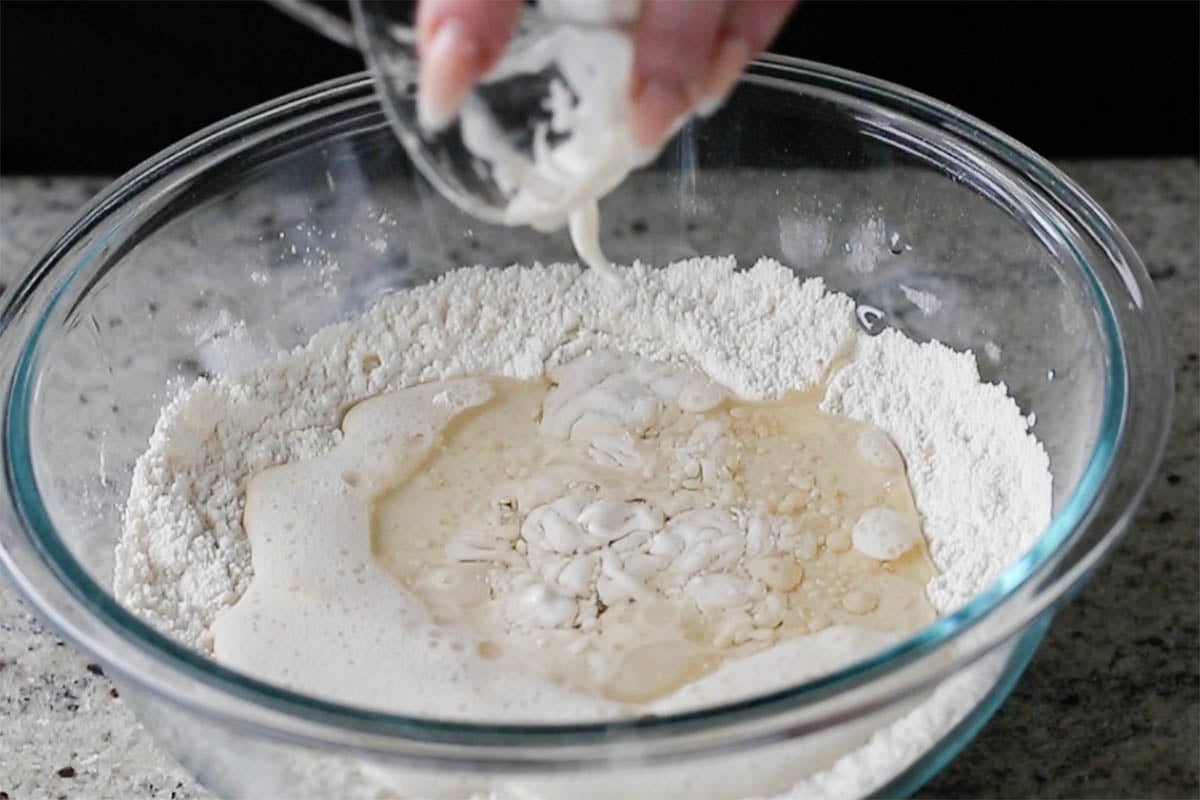 adding the rest of the wet ingredients to the dry