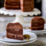 slices of mocha mousse cake with the whole cake in the background
