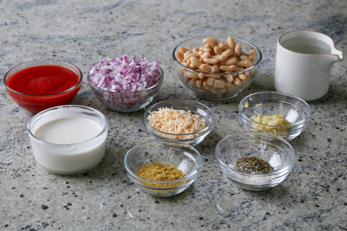 beans, tomato, non-dairy cream, and other easy rosé sauce ingredients on the kitchen counter