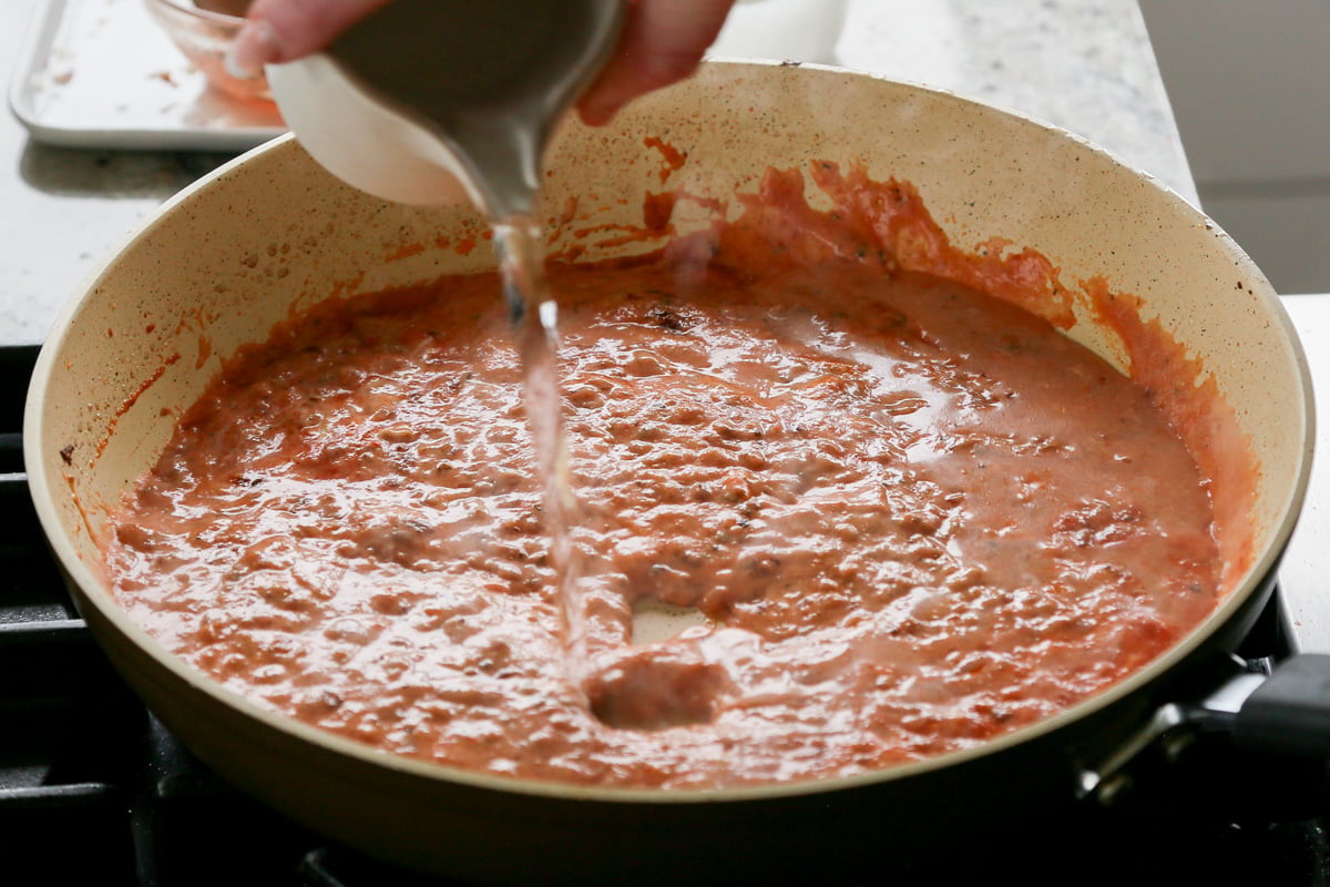 adding water to the simple rosé sauce