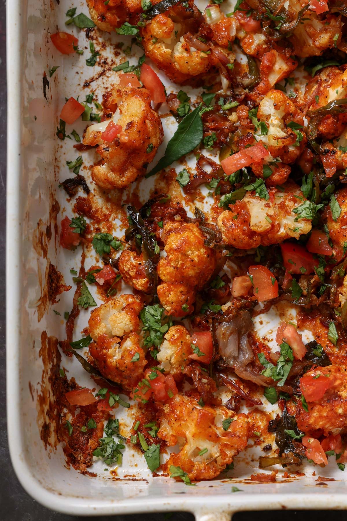 close up of cauliflower pepper fry in the pan after baking and mixing together
