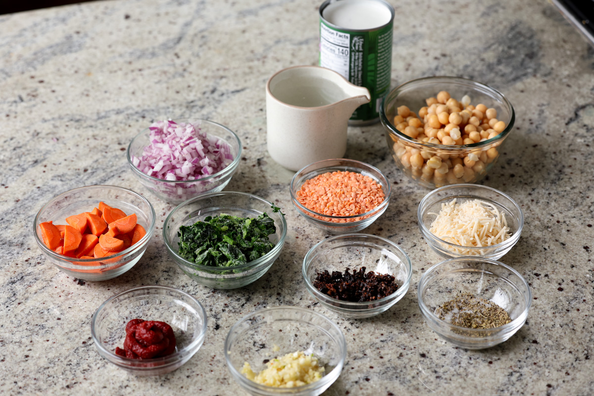 lentil chickpea stew ingredients in bowls on the kitchen counter