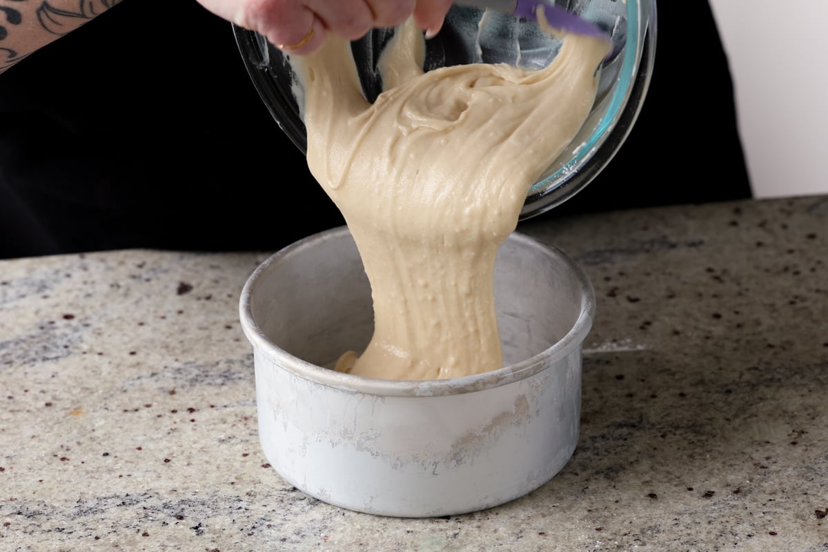 pouring the cake batter into the pan