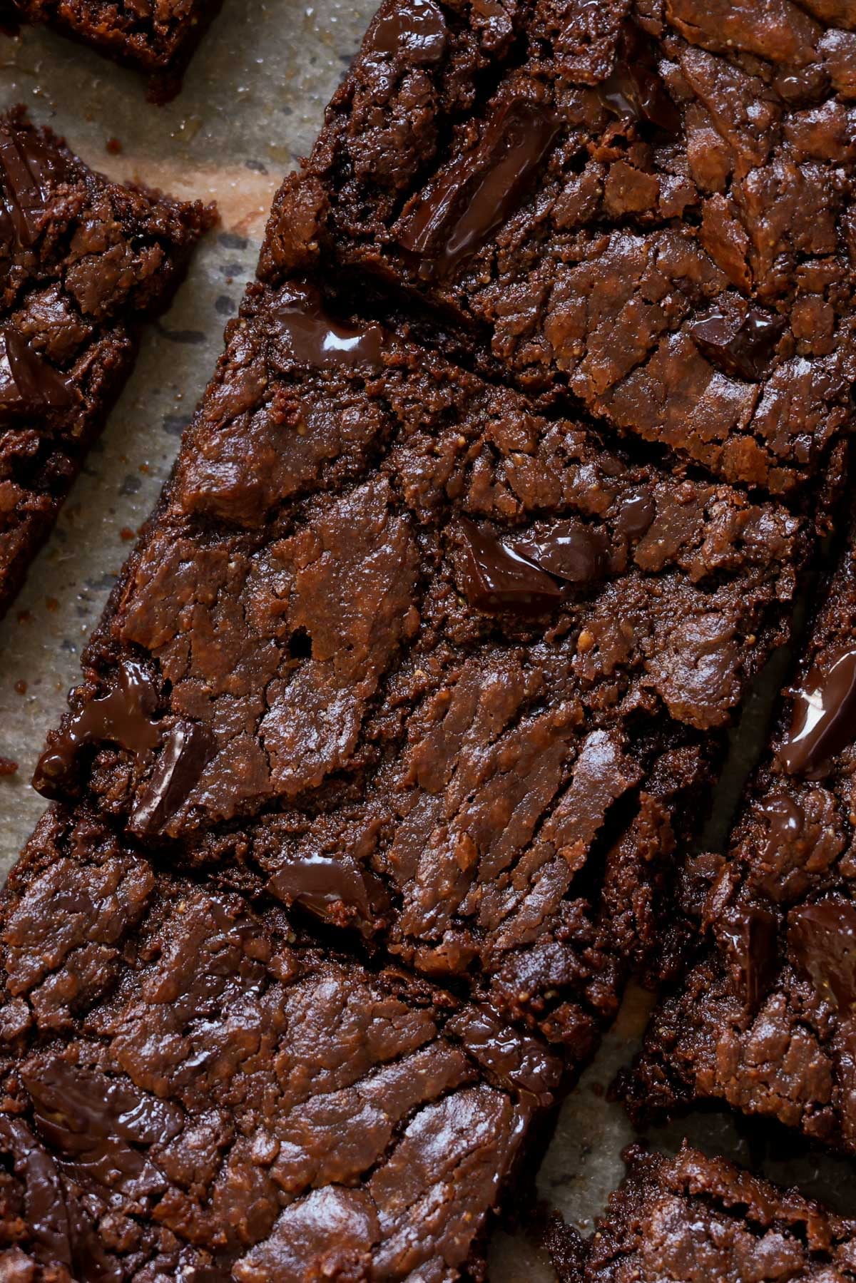 extreme close-up of sliced almond butter brownies on the cutting board
