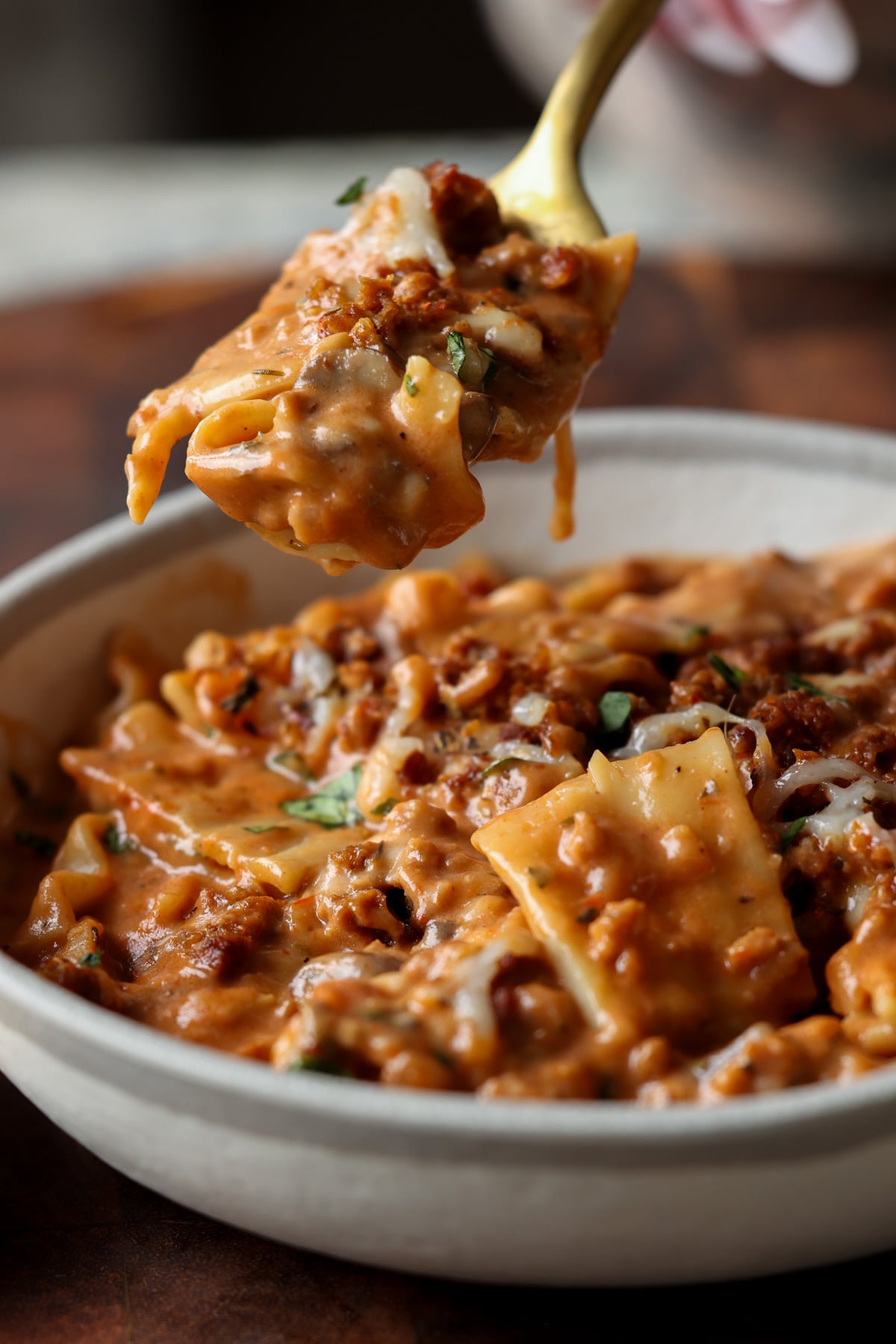 spooning a bite of creamy lasagna soup