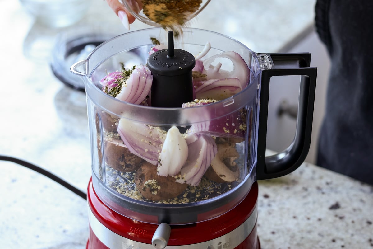adding lentil meat ingredients to the food processor
