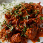 kosha mangsho on a plate with rice