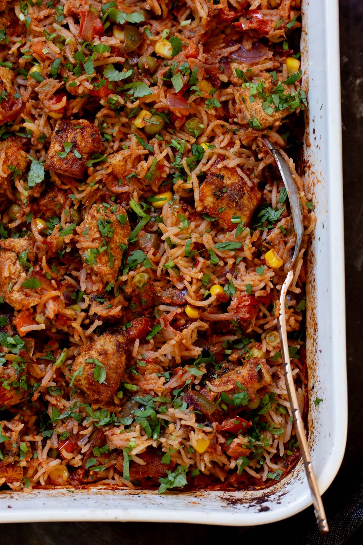 close-up of tikka masala rice in the baking pan after baking and fluffing