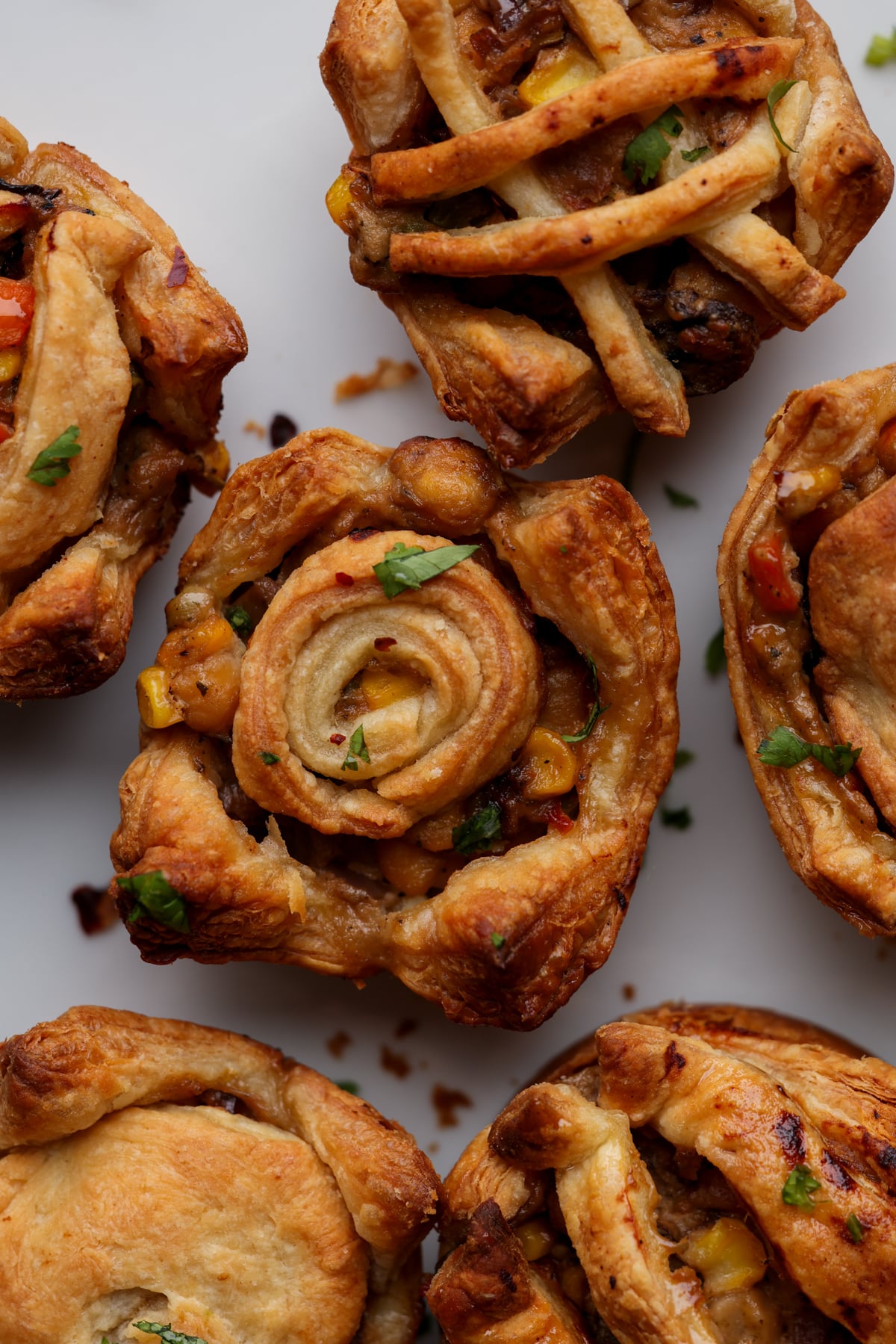 mini pot pies cooling on a plate