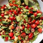 Balela chickpea cherry tomato cucumber salad in a white bowl