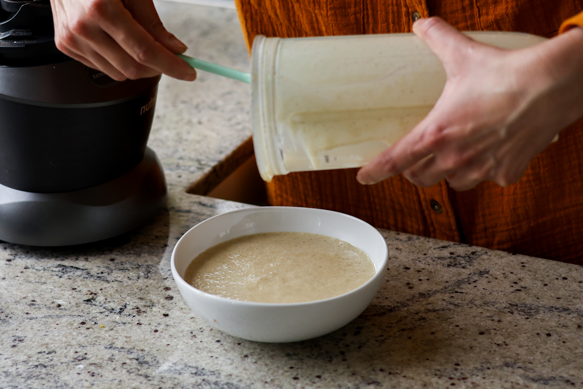 adding pistachio cream to the bowl