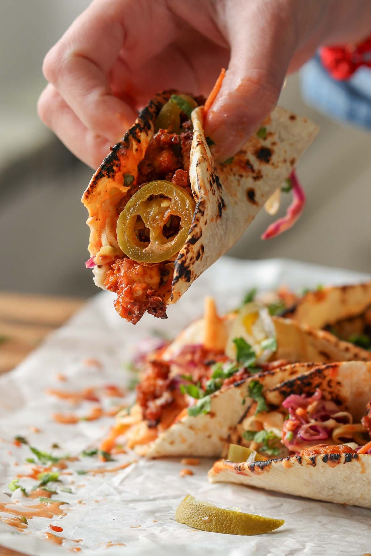 bite shot of a gochujang taco