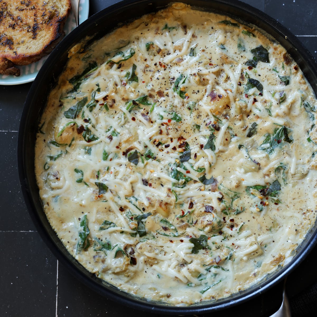 spinach artichoke gnocchi in the pan