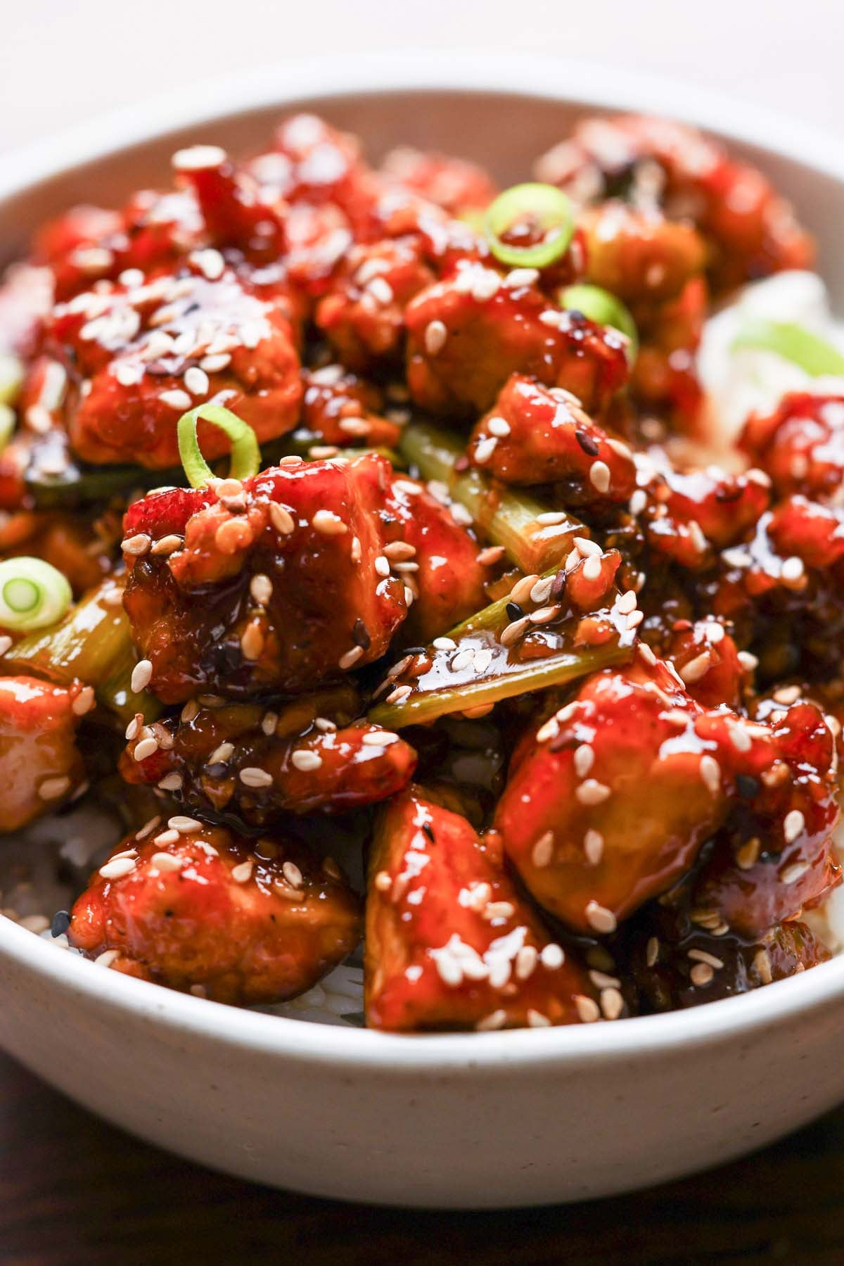 close-up of teriyaki tofu in a bowl with rice