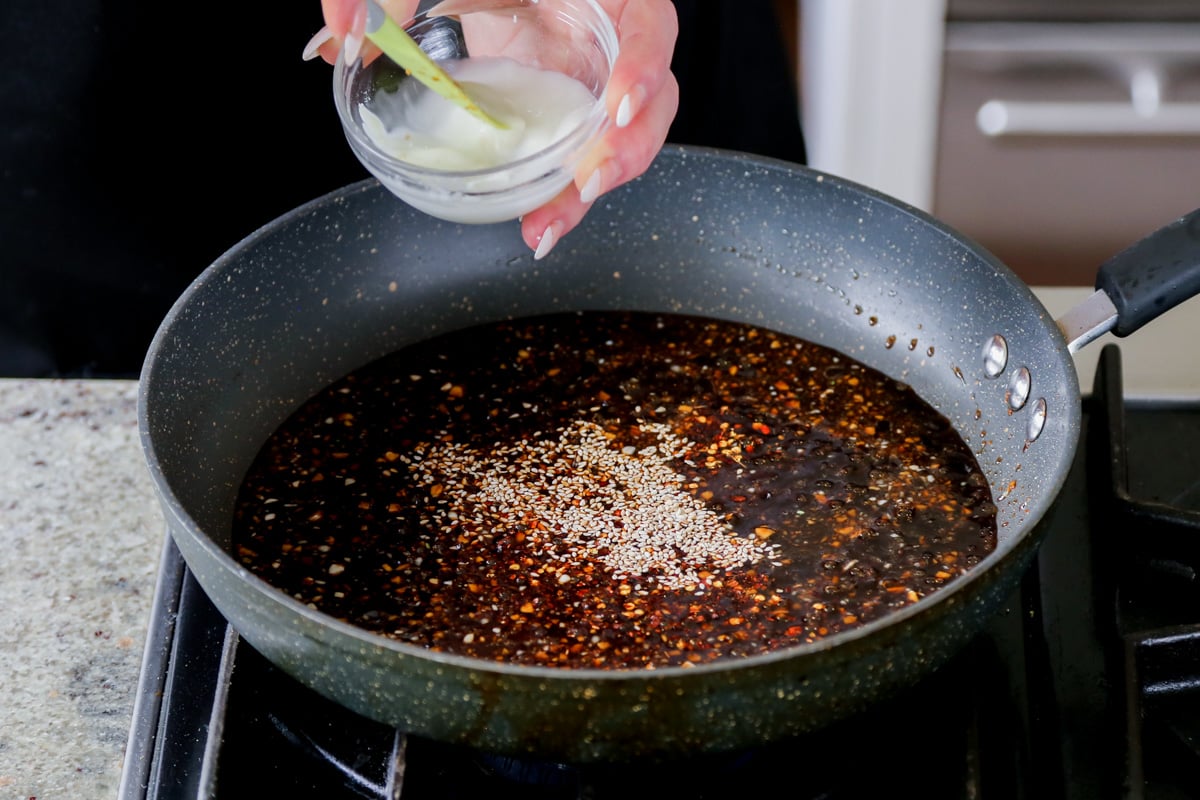 adding cornstarch slurry to the pan