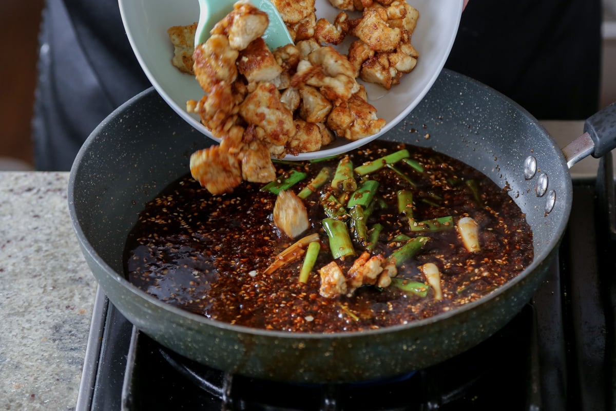 adding crispy tofu to the pan