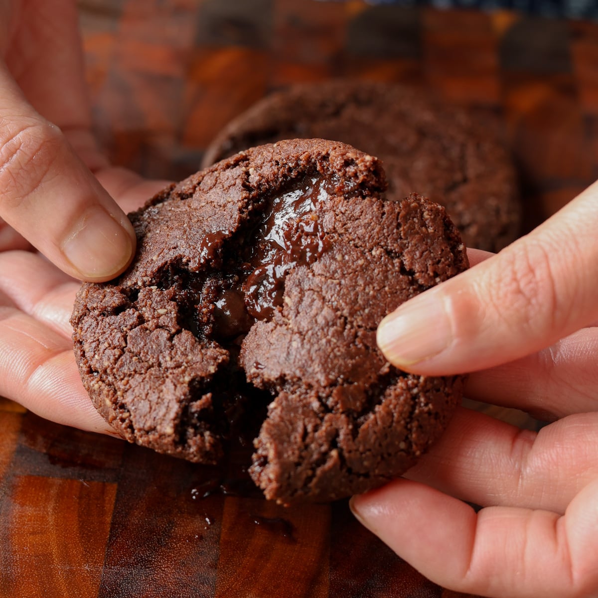 breaking open a lava cookie so you can see the inside