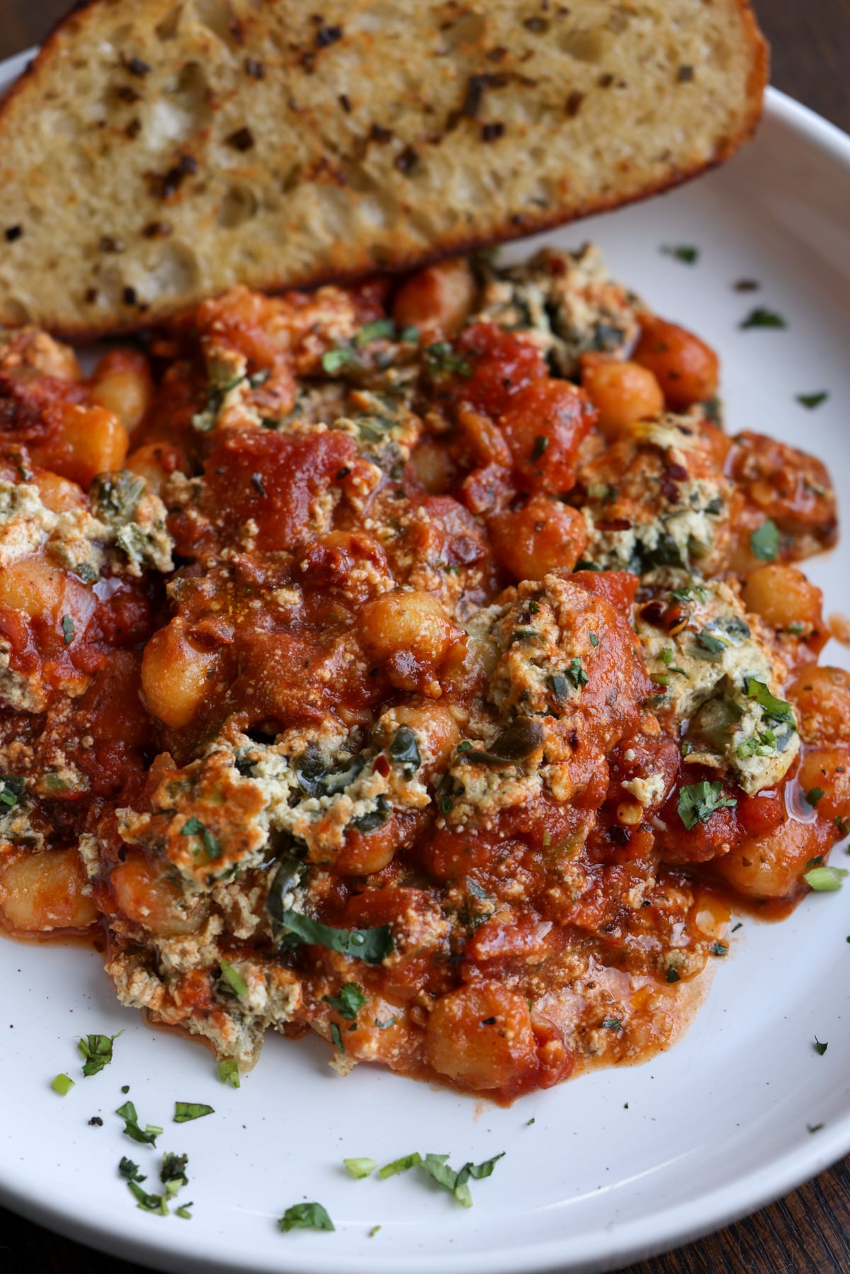 skillet gnocchi in a bowl with garlic bread