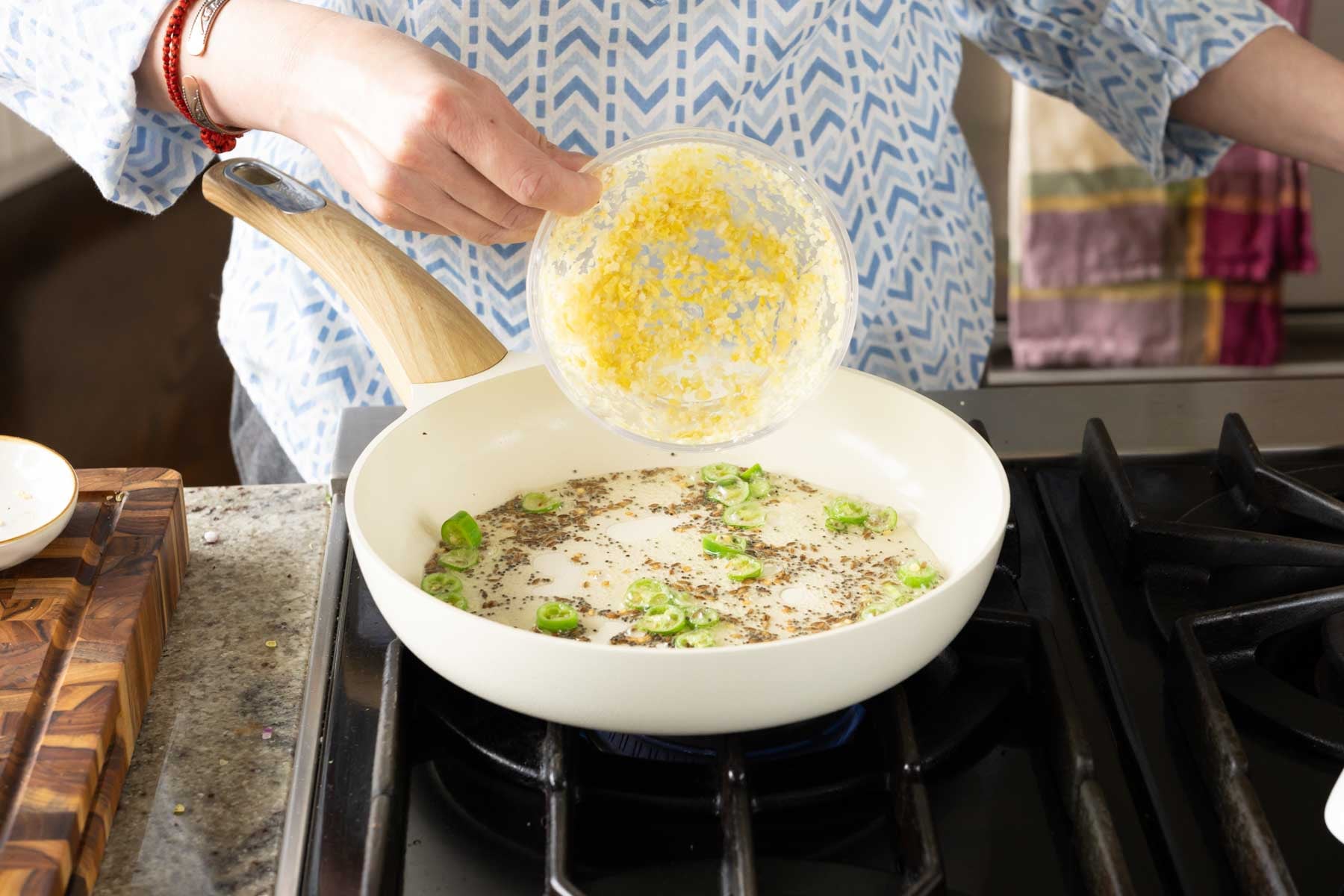 adding ginger and garlic to the pan