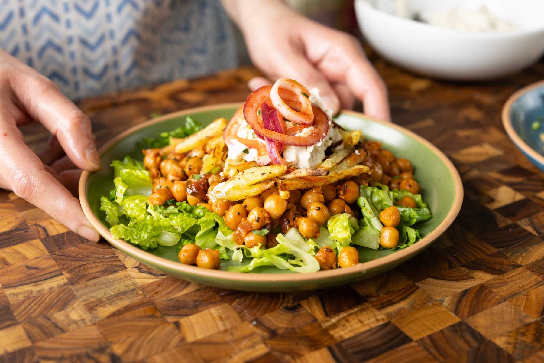 salad made with chili garlic chickpeas and crispy potatoes