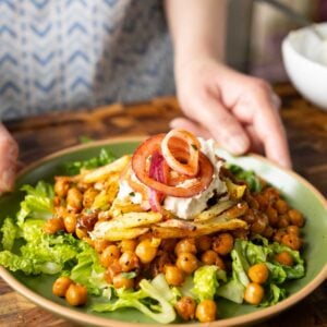 salad made with chili garlic chickpeas and crispy potatoes