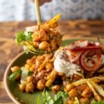 spoon taking a bite of chili garlic chickpeas
