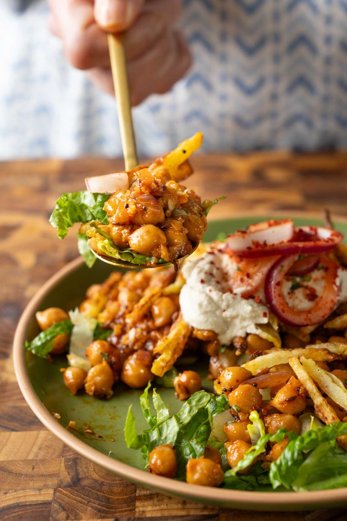 spoon taking a bite of chili garlic chickpeas
