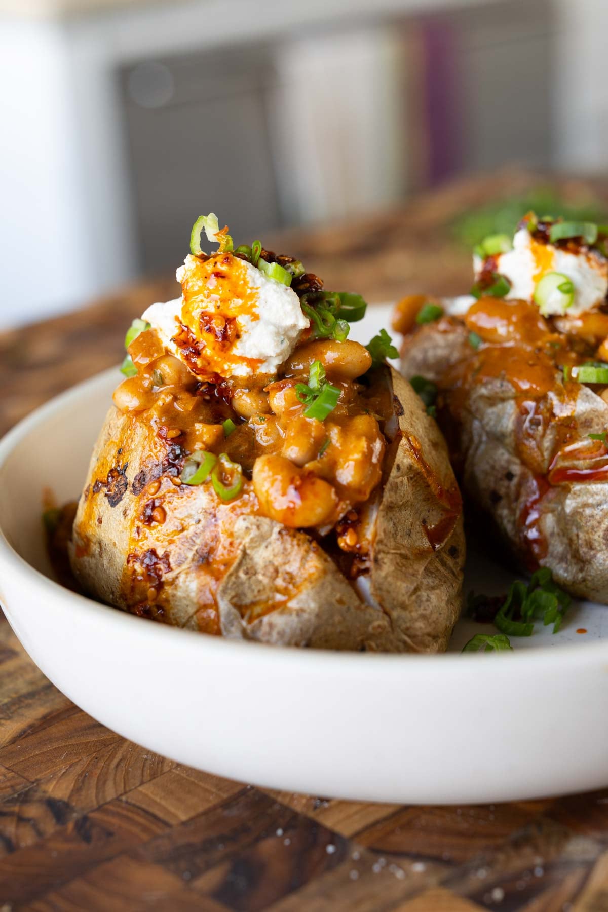baked potatoes topped with the chili garlic beans