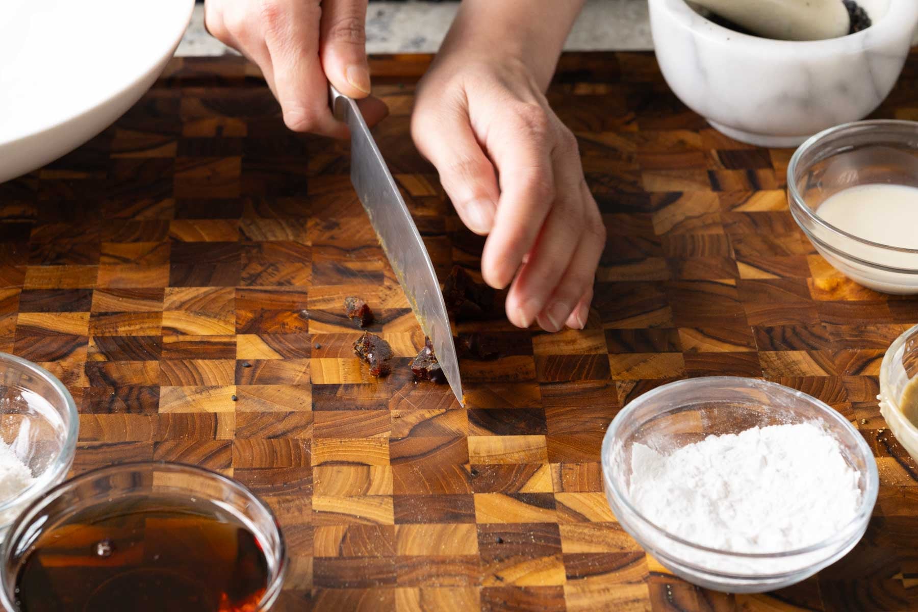 chopping the dates on a cutting board