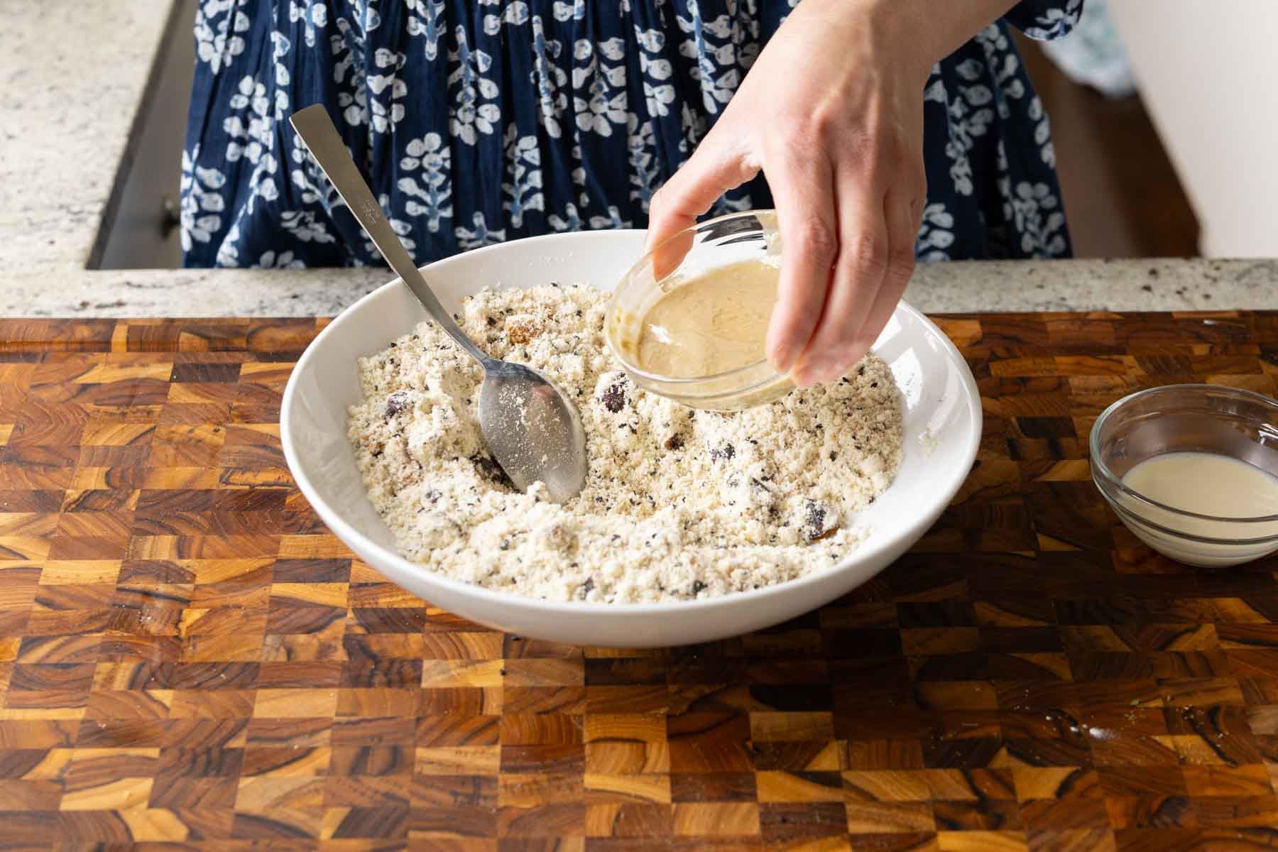 adding wet ingredients to the bowl
