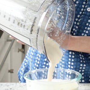 pouring neutral whipped tofu base into a storage container