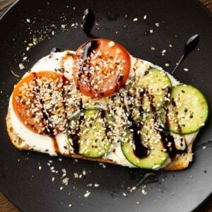 whipped tofu toast on a black plate