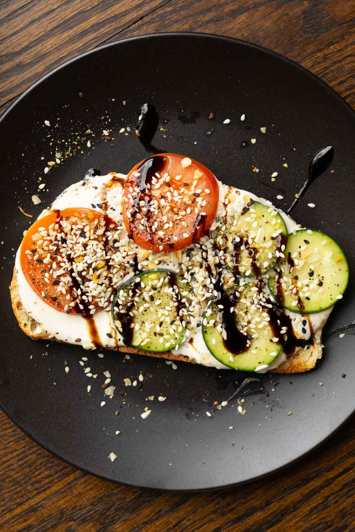whipped tofu toast on a black plate