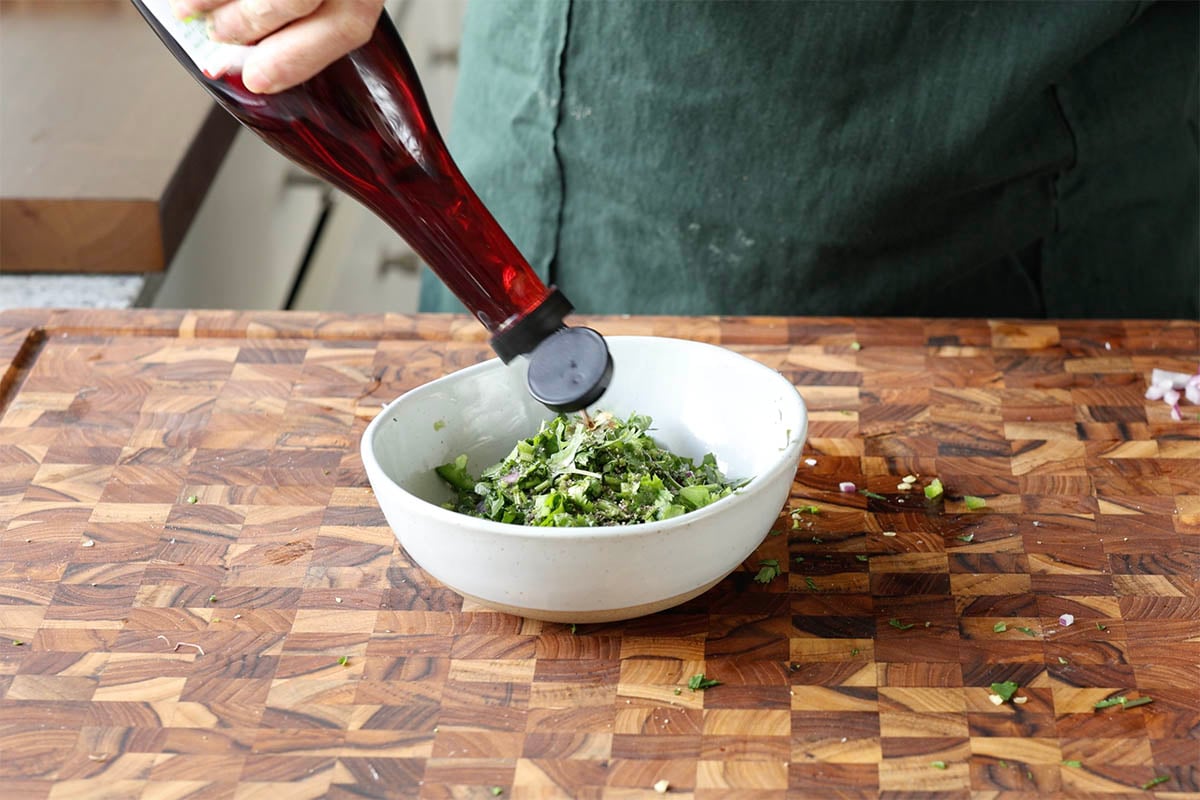 adding red wine vinegar to the gremolata