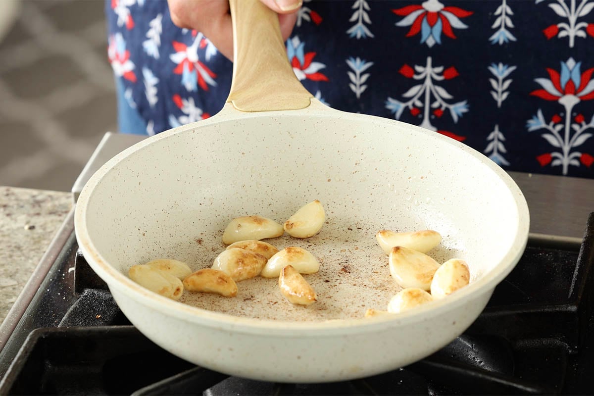 garlic cloves in the pan after toasting