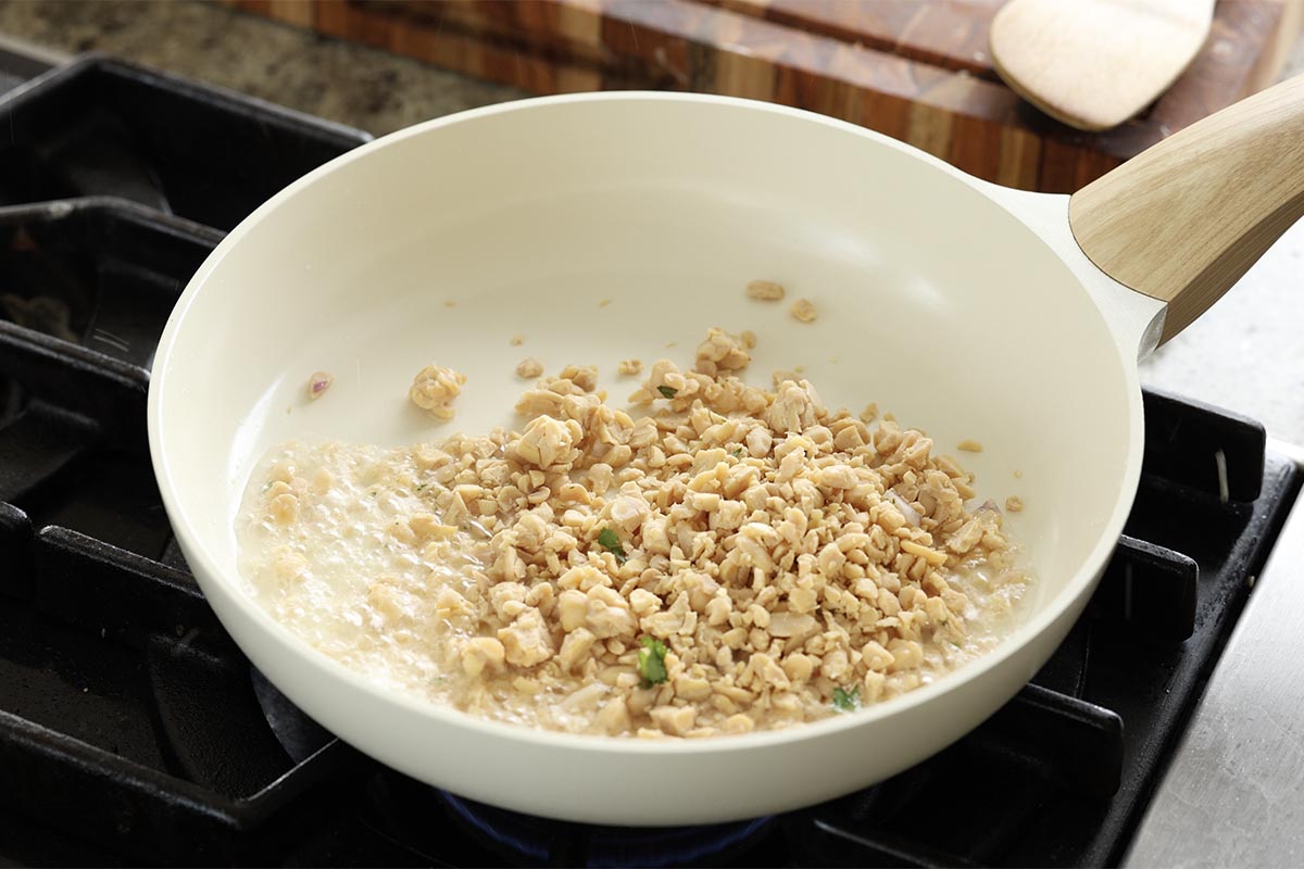 adding crumbled tempeh to the pan