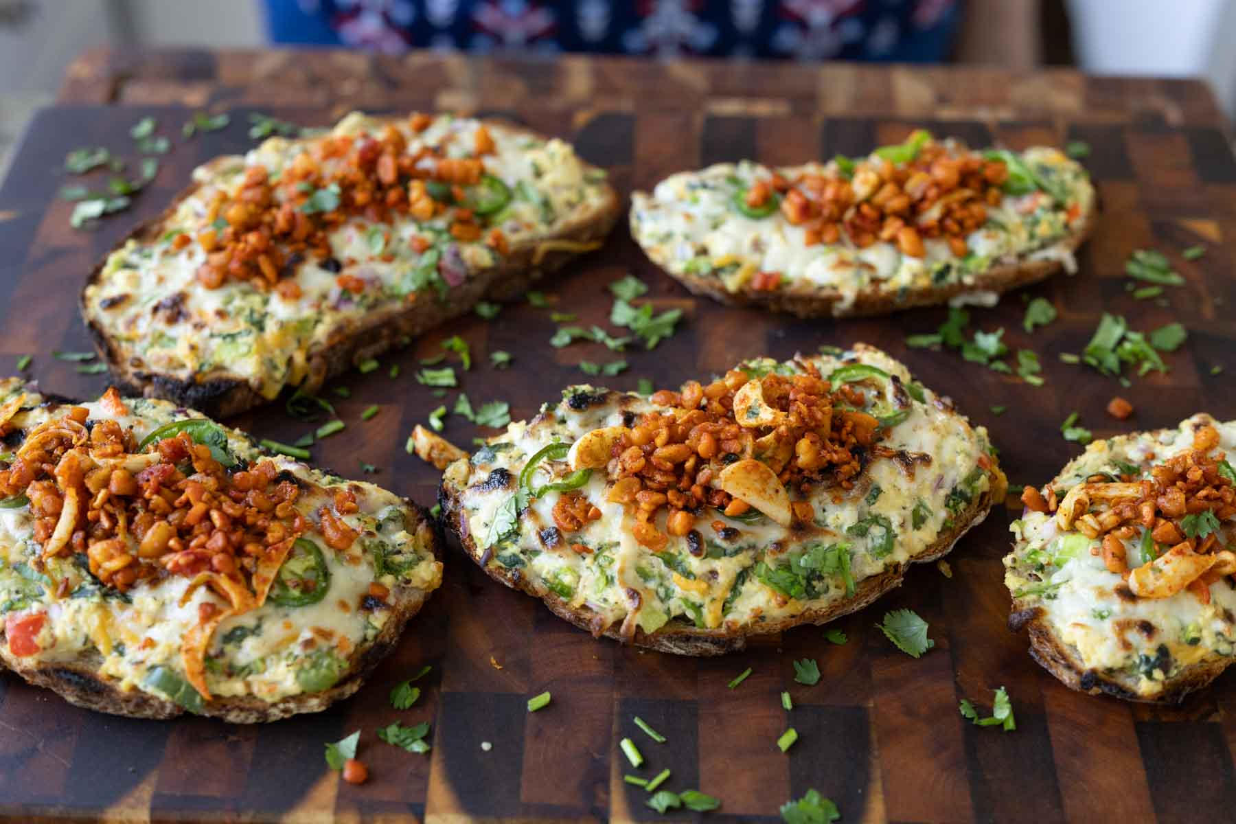 Indian chilli cheese toasts on a cutting board
