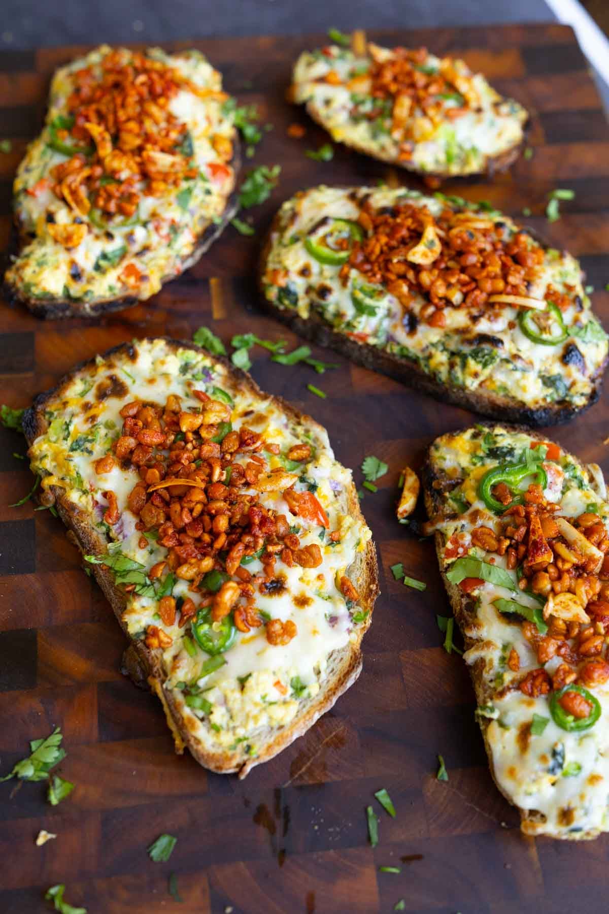 Indian chilli cheese toasts on a cutting board