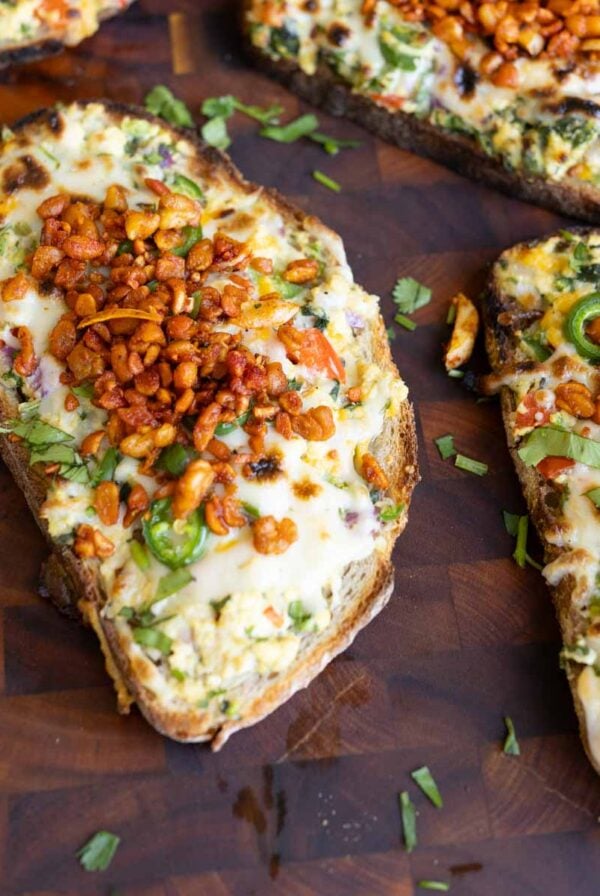 Indian chilli cheese toasts on a cutting board