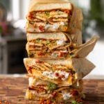 stack of coconut tofu sandwiches on a cutting board