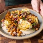 plate with a cabbage wedge and all of the toppings