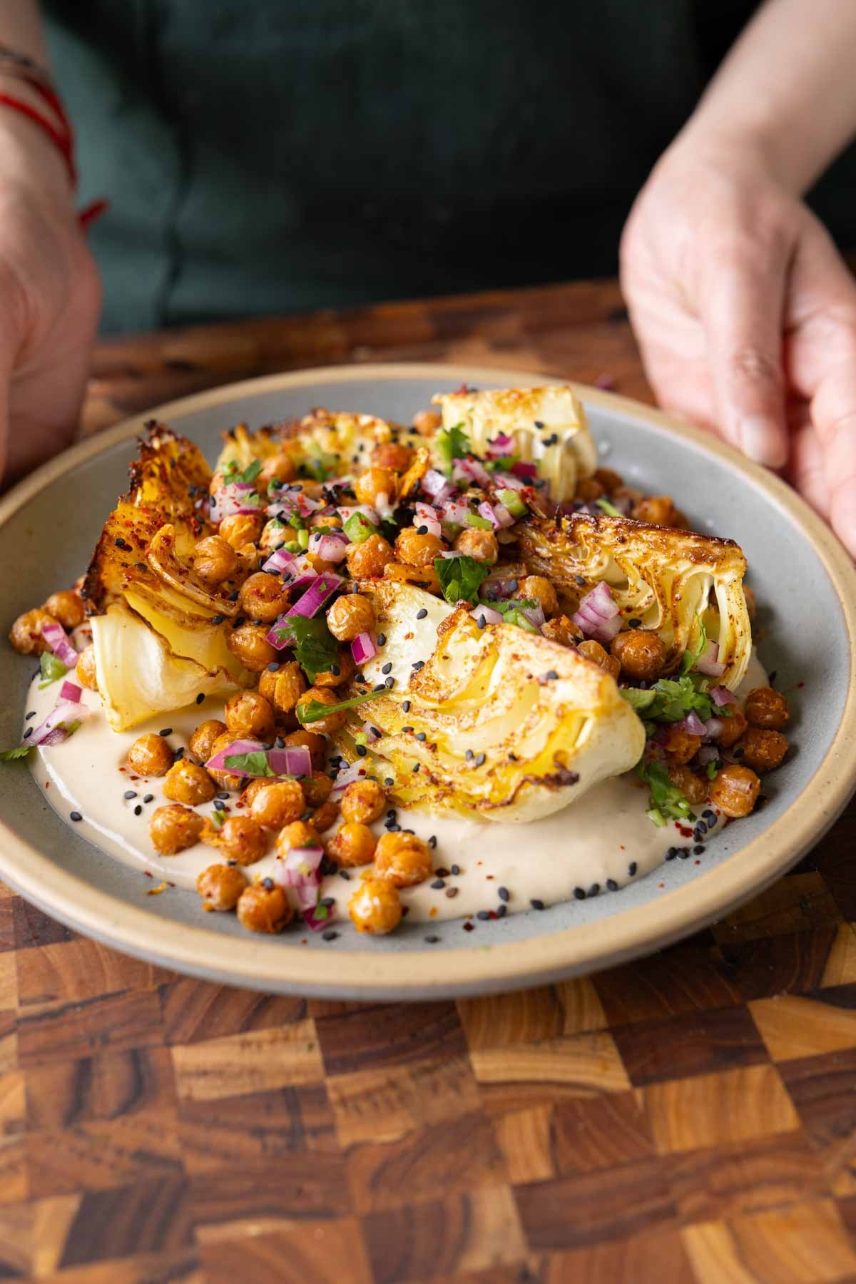 plate with a cabbage wedge and all of the toppings