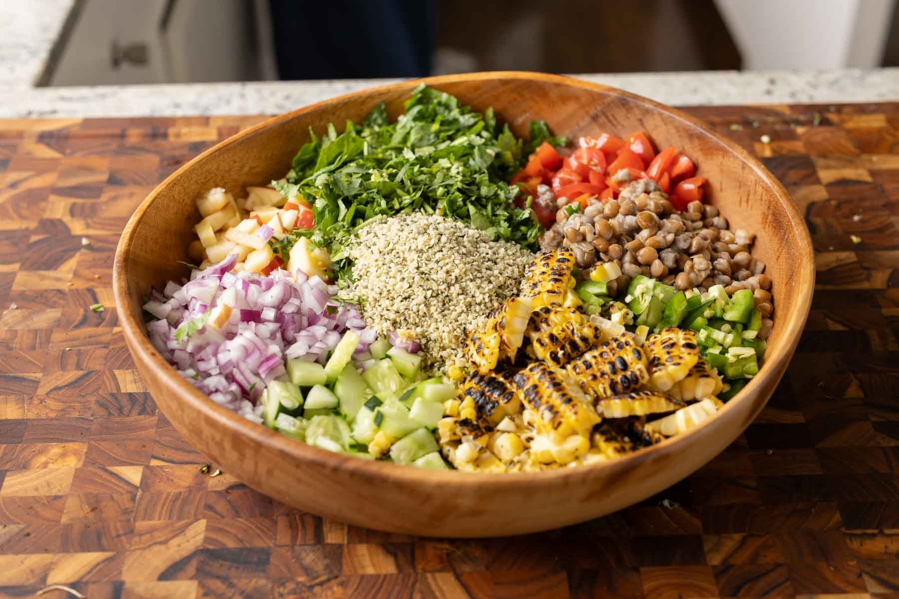 lentil dip ingredients in a bowl before adding the dressing