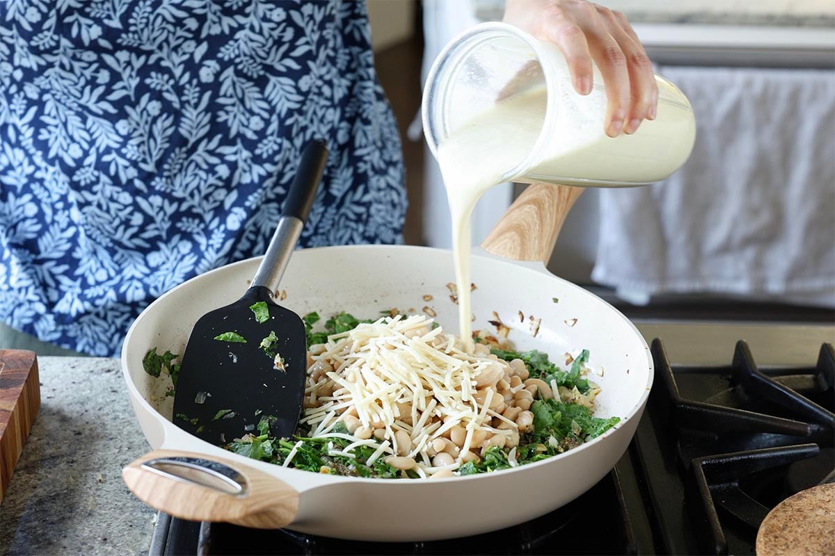 adding the cheese and cream sauce